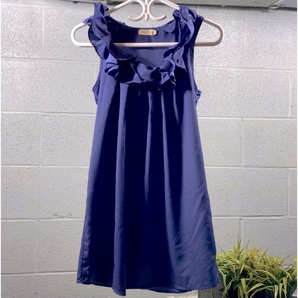 Pins and needles ruffled sleeveless top​​​​​​​​​​​​​​​​
